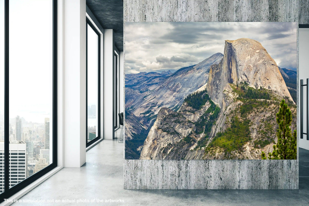 Large wall art of a mountain landscape in a modern room with large windows.